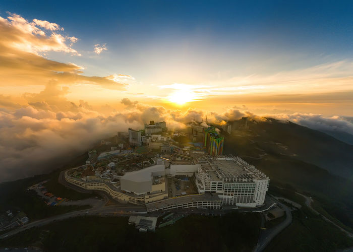 High angle view of buildings against sky during sunset