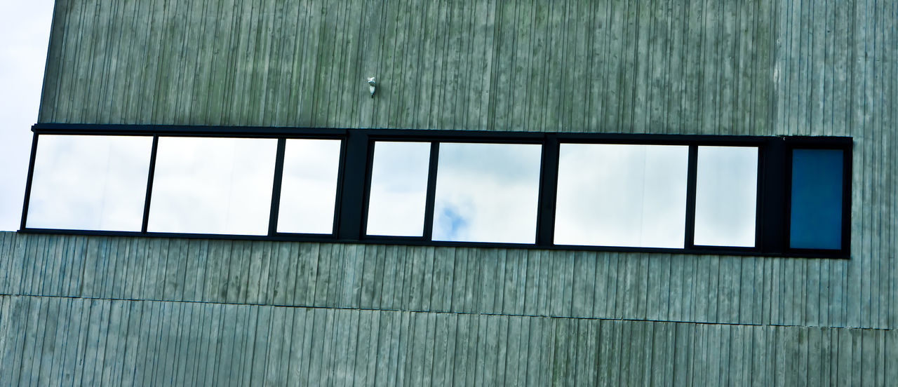 CLOSE-UP OF WINDOW AGAINST BUILDING
