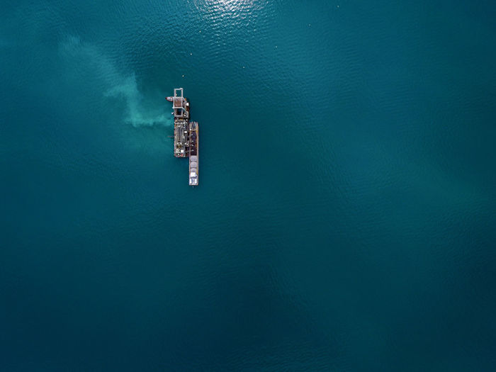 Aerial view of drilling rig in sea