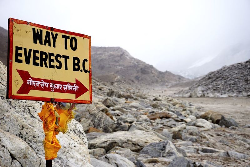 Classic traditional and colourful sign signposting the way to mount everest base camp