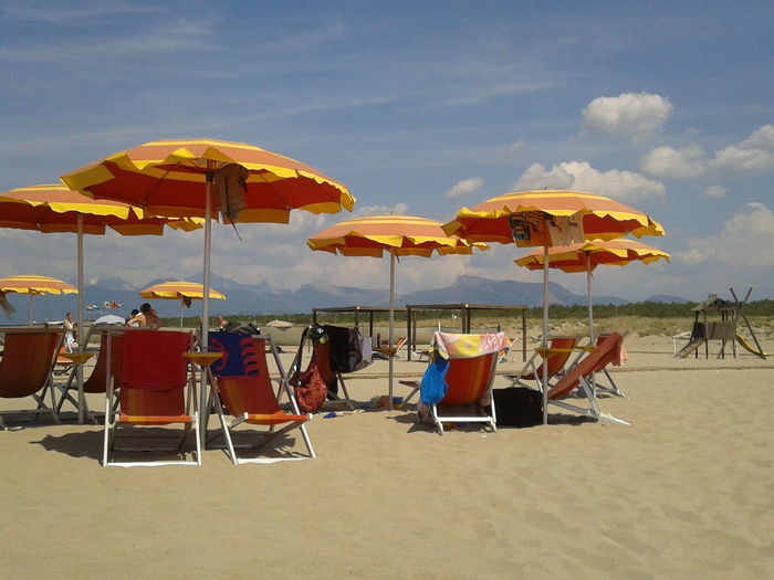 Beach umbrellas with umbrellas on beach