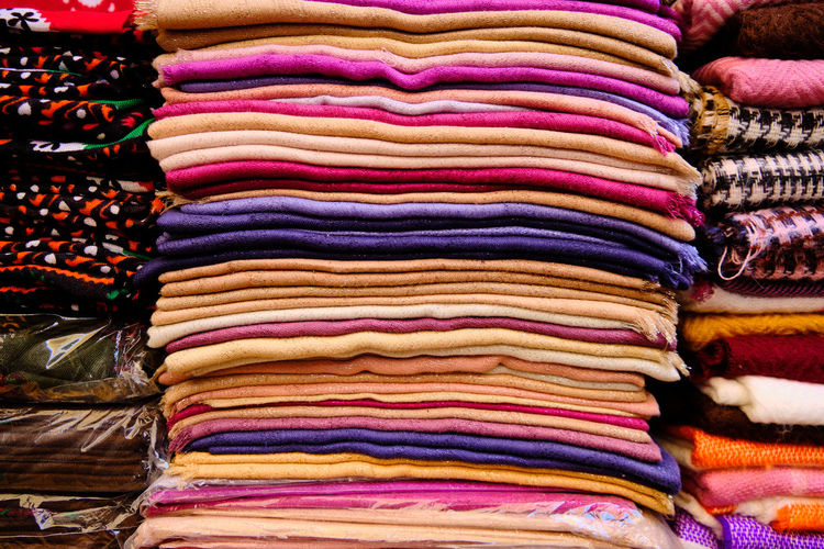 Stack of multi colored for sale at market stall