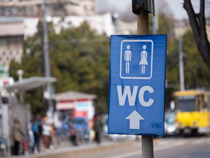 Close up of wc sign for men and women