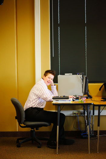 Smiling businessman working at office
