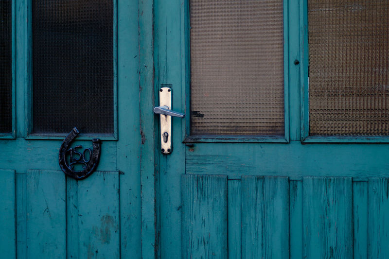 Horseshoe on closed blue door