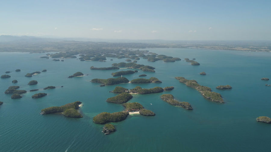 Aerial view of small islands with beaches and lagoons in hundred islands national park, pangasinan