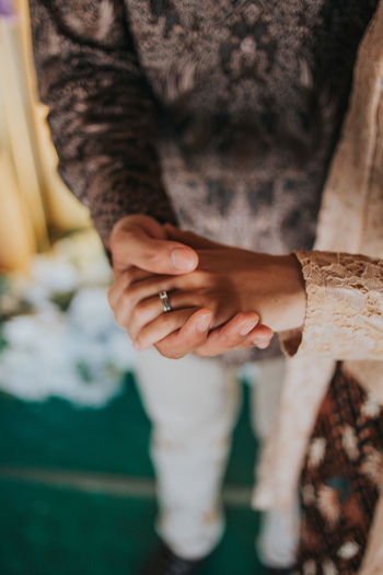 Close-up of woman holding hands