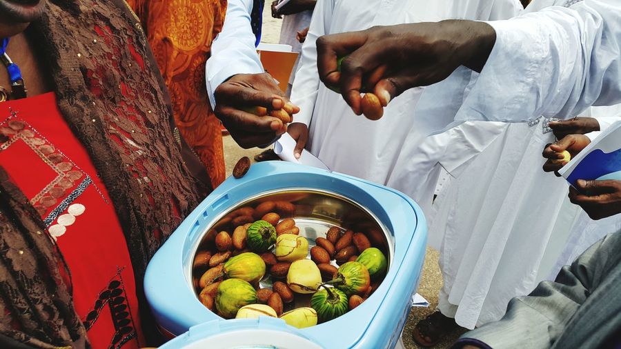High angle view of people with kola nuts