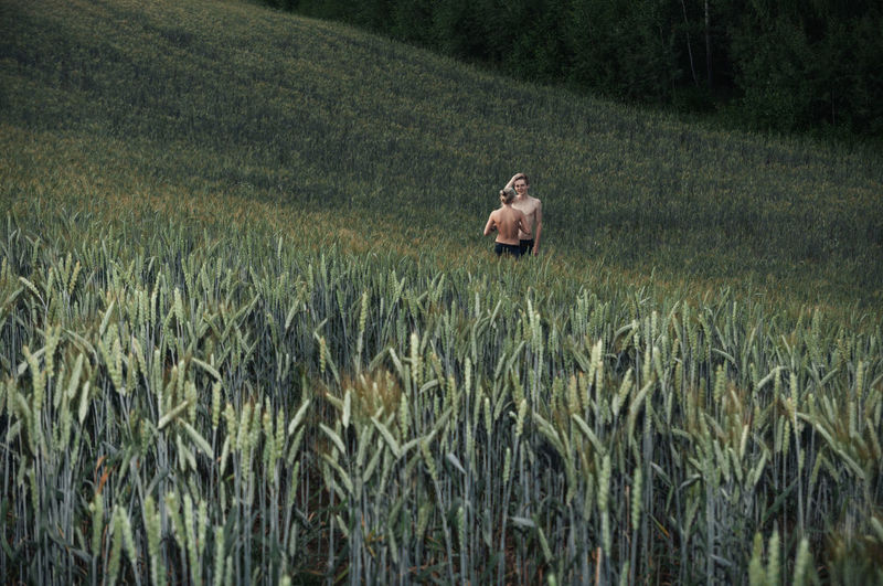Couple standing in farm