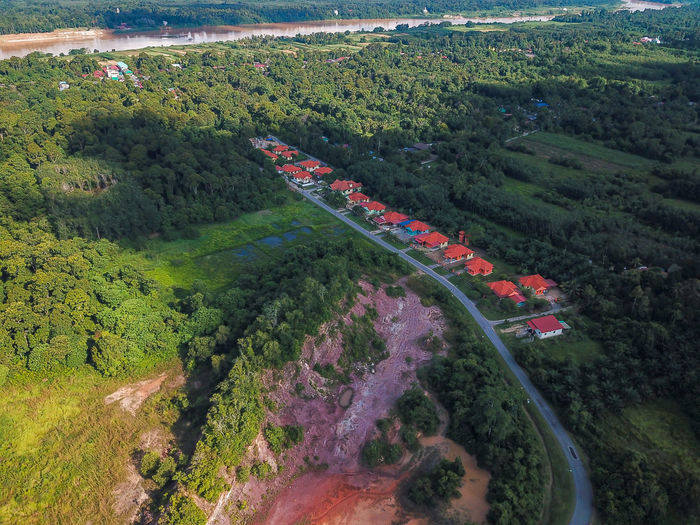 High angle view of road amidst trees in tanah merah, malaysia.
