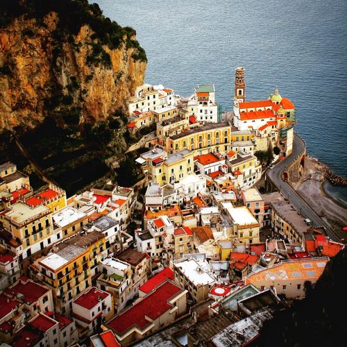High angle view of townscape by sea