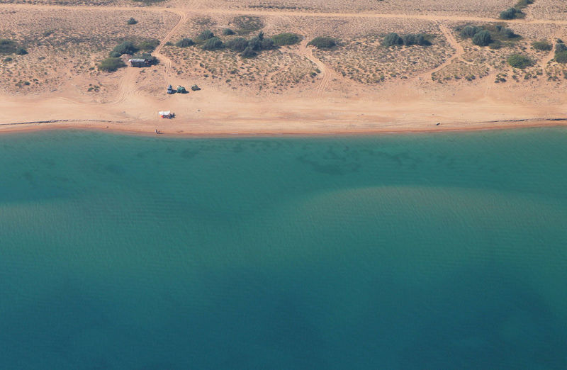 Aerial view of sea by desert