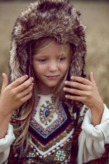 Girl indian shaman blonde in a poncho and a dream catcher