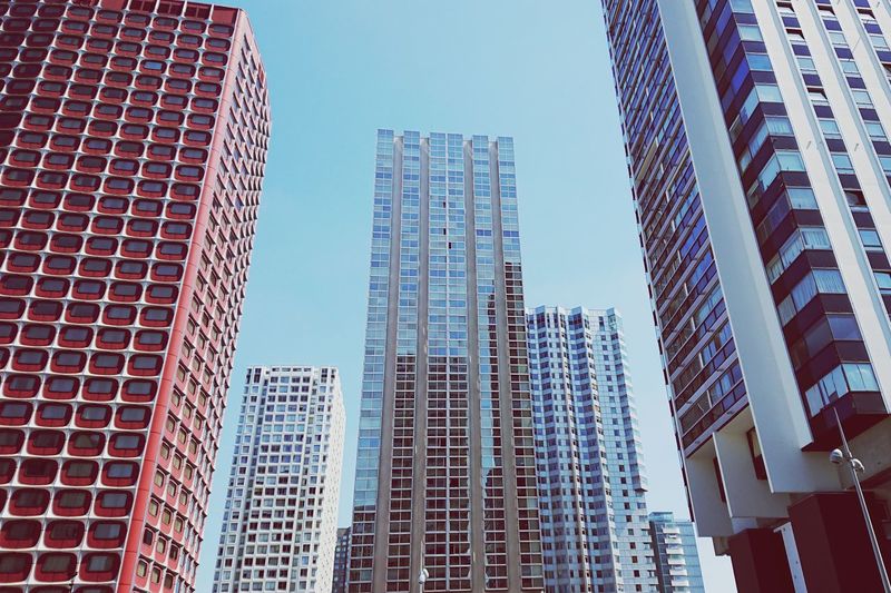 Low angle view of modern buildings against clear sky