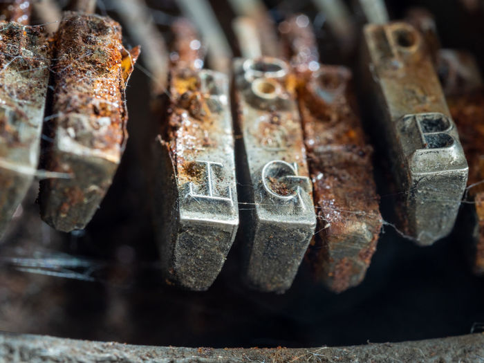 Close-up of rusty machine part of typewriter