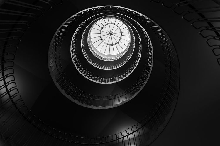 Low angle view of spiral staircase in building