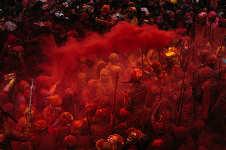 People playing holi in city