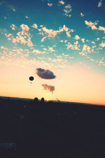 Scenic view of landscape against sky at sunset