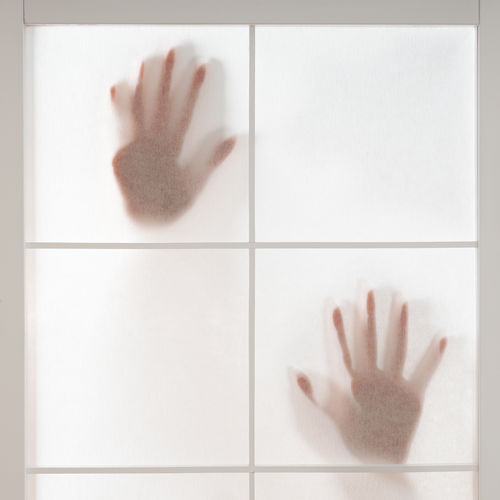 Close-up of hand on wall