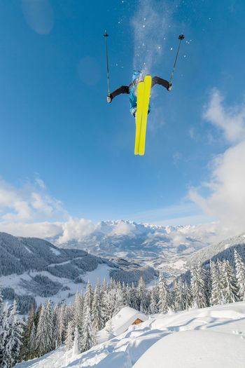 Freeride skier captured mid air in the backcountry, werfenweng, austria.
