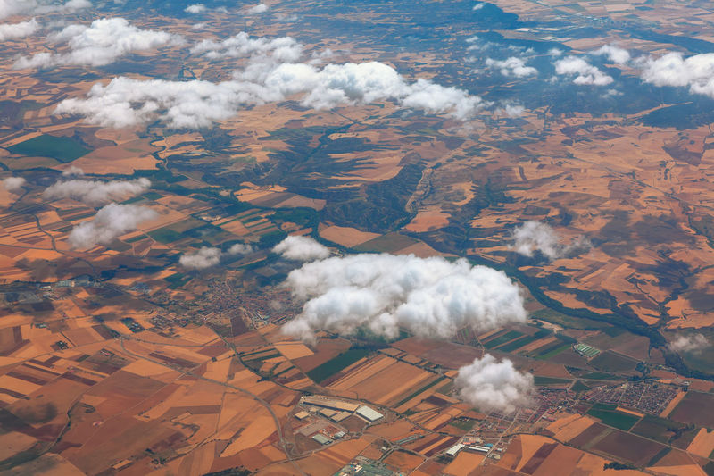 White clouds flying over the southern country . aerial view of dry climate landscape