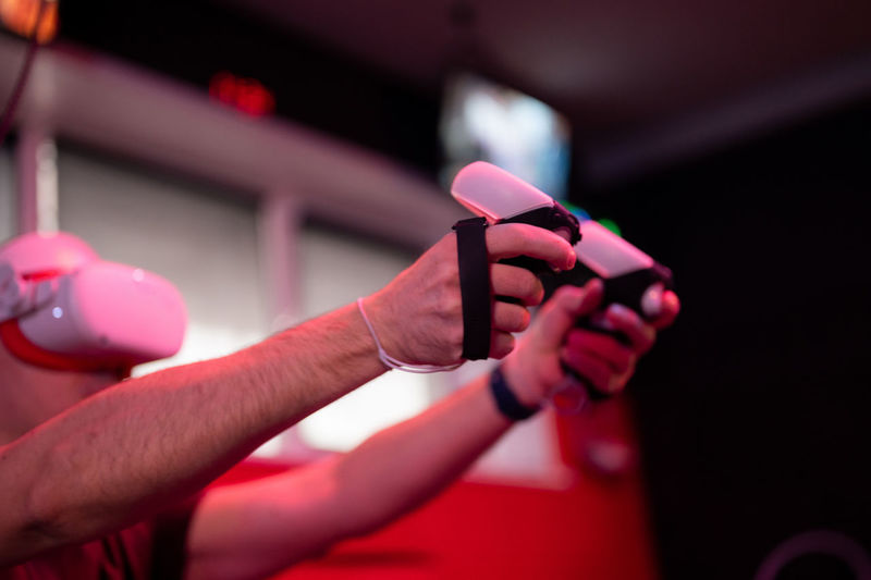Vr game and virtual reality. man gamer fun playing on futuristic simulation video shooting game