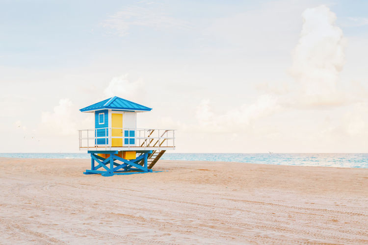 Light airy tropical florida landscape with blue lifeguard house. american florida beach ocean view 