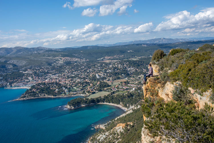 A men on a cliff facing the mediterranean sea (1)