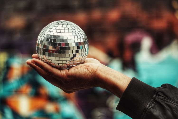 Cropped hand holding disco ball
