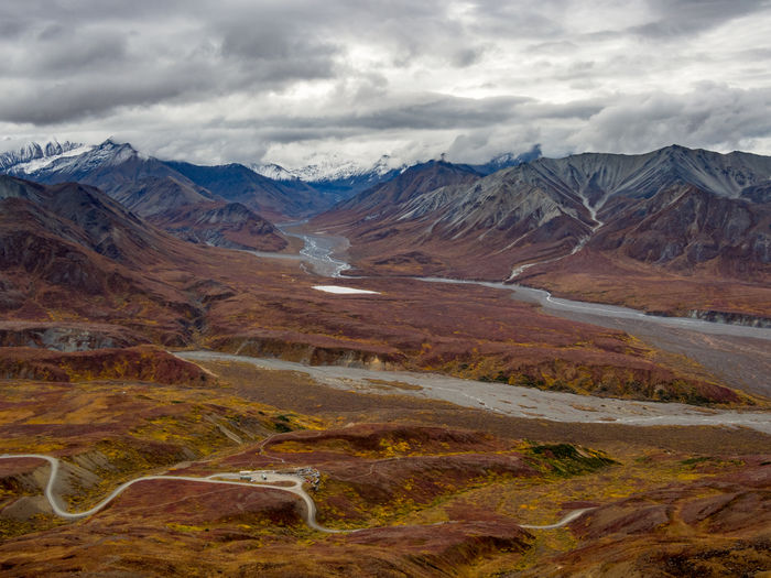 Expansive view of the autumn tundra and snowcapped mountains of denali national park, alaska.