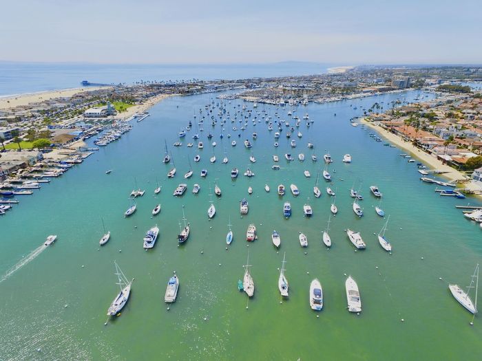 High angle view of boats moored in sea against sky