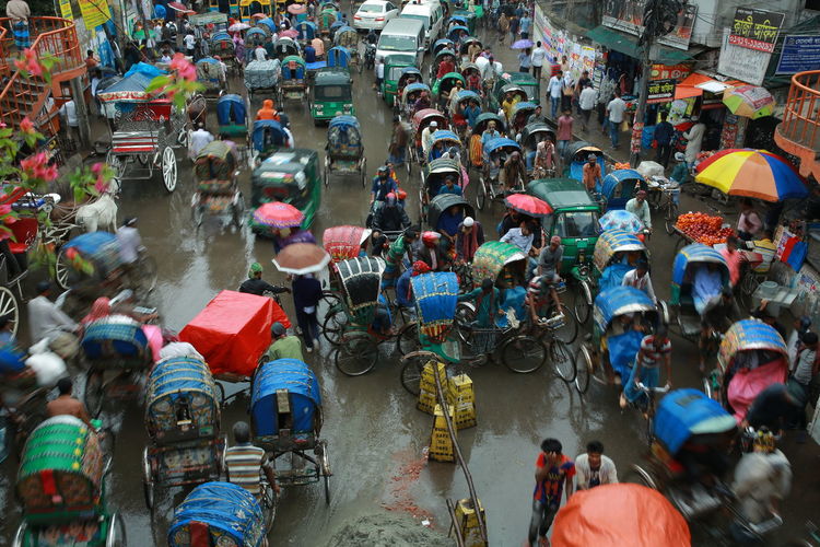 High angle view of people on street in rain