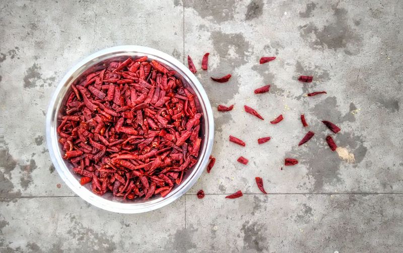 High angle view of red chili peppers in container