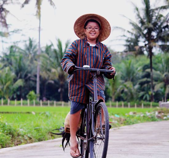 Portrait of man riding bicycle