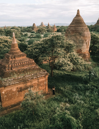 High angle view of woman standing by ancient temple
