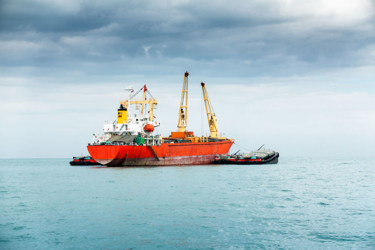 Ship in sea against sky