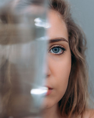 Close-up portrait of young woman looking away