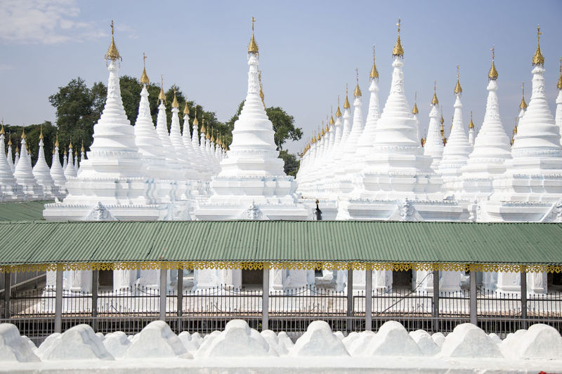 White small stupas at sanda muni pagoda during sunny day, mandalay