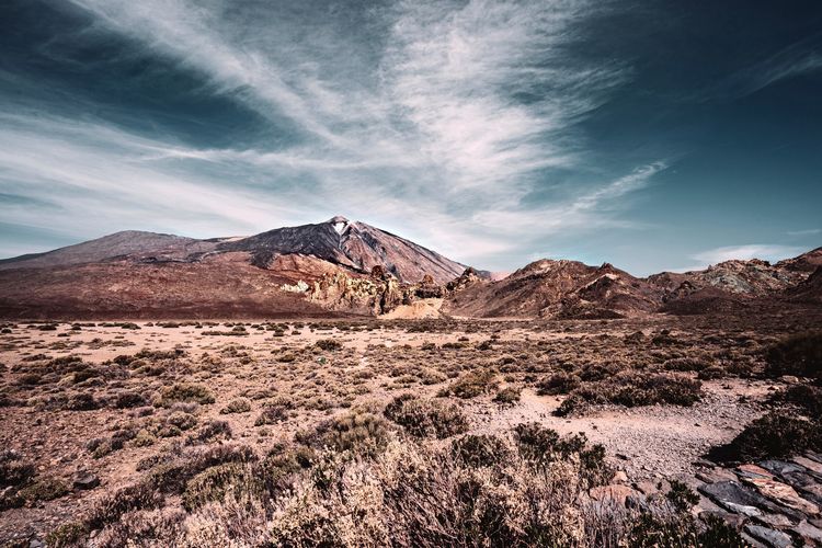 Scenic view of landscape and mountains against sky - tenerife island - teide national park 