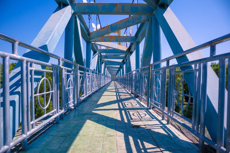 View of footbridge against sky