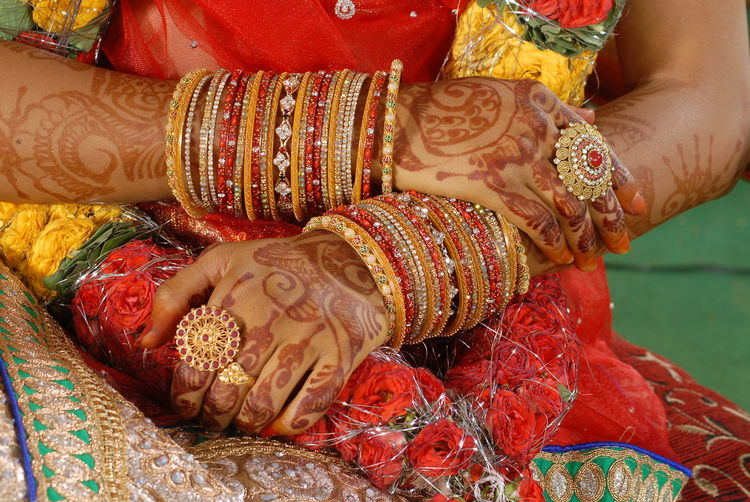 Midsection of bride at wedding ceremony