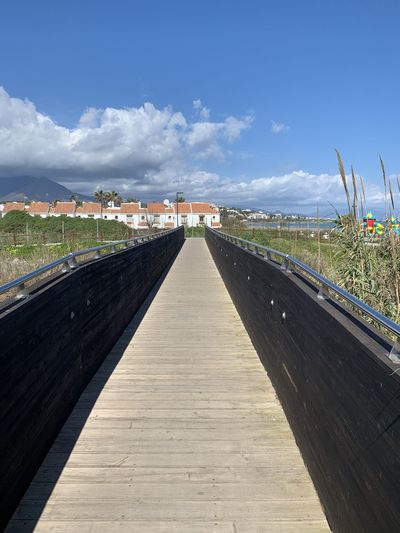 Straight footpath over a bridge in the municipality of sabinillas, spain