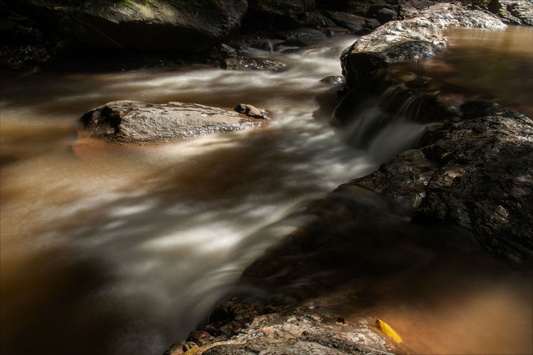 Water flows through the rocks on the mountain