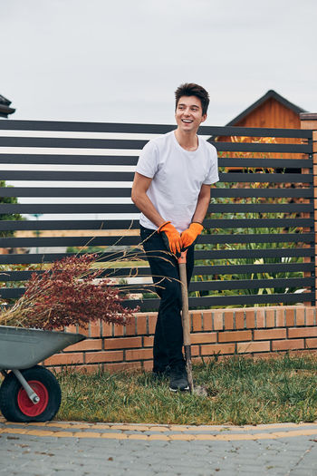 Young man standing at yard