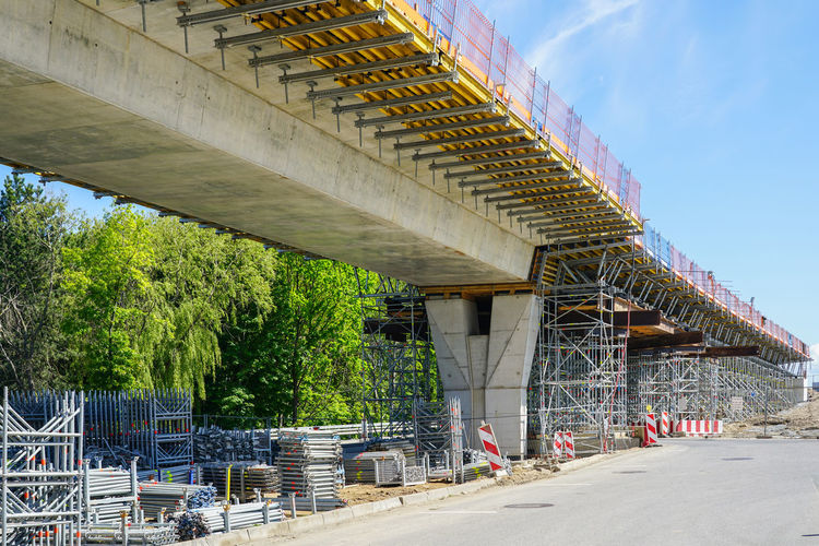 New modern road overpass bridge construction site with lots of scaffolding and concreting framework