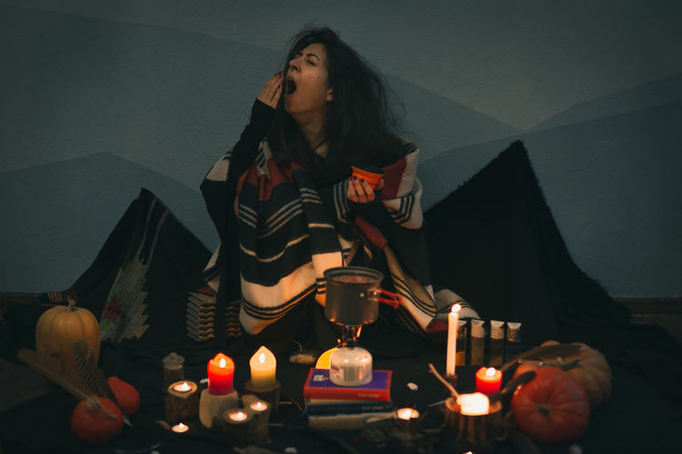 Close up yawning woman preparing food portrait picture