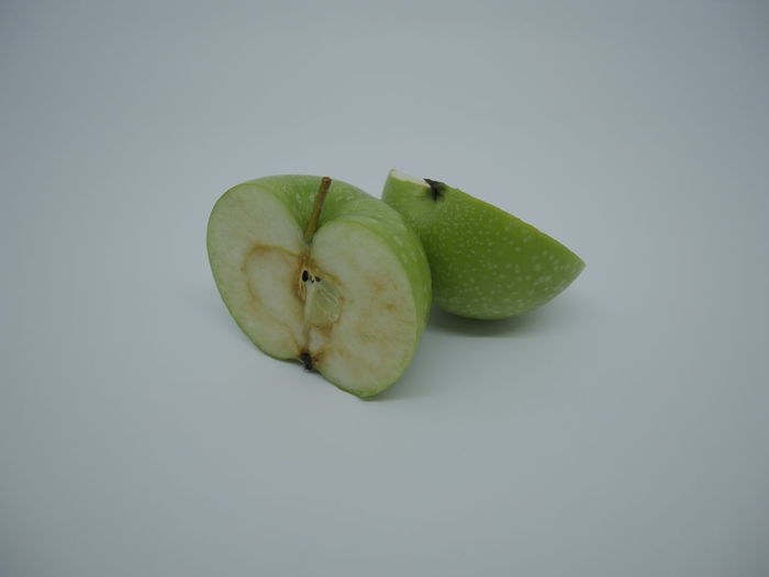 High angle view of apple against white background