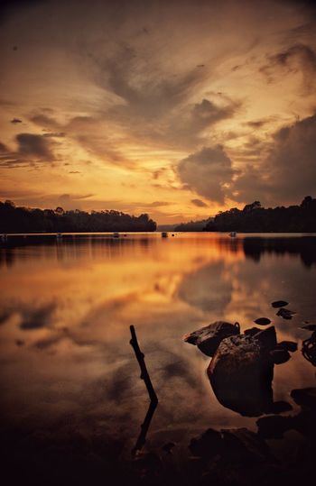 Scenic view of lake against sky during sunset