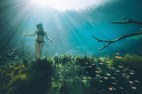 Woman swimming underwater 