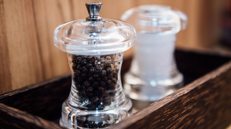 Close-up of pepper shaker on table